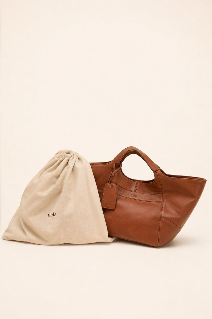 Nora with its cotton dust bag